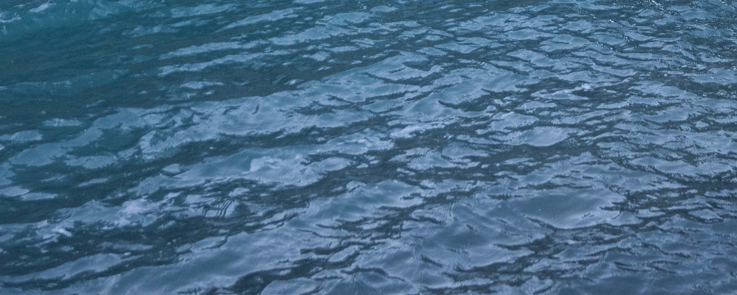 Close up of blue water.